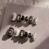 https://shmuker.oss-cn-hangzhou.aliyuncs.com/data/oss/643eba85f5b37d6cf4da3abe/65d16d7ec8f2c97966e38c95/Vintage-series-bow-high-sense-wear-nail-1.jpg