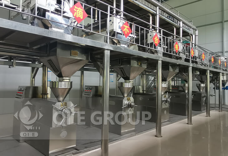Peanut oil extraction line showing synchronized operations of pre-treatment and press machines