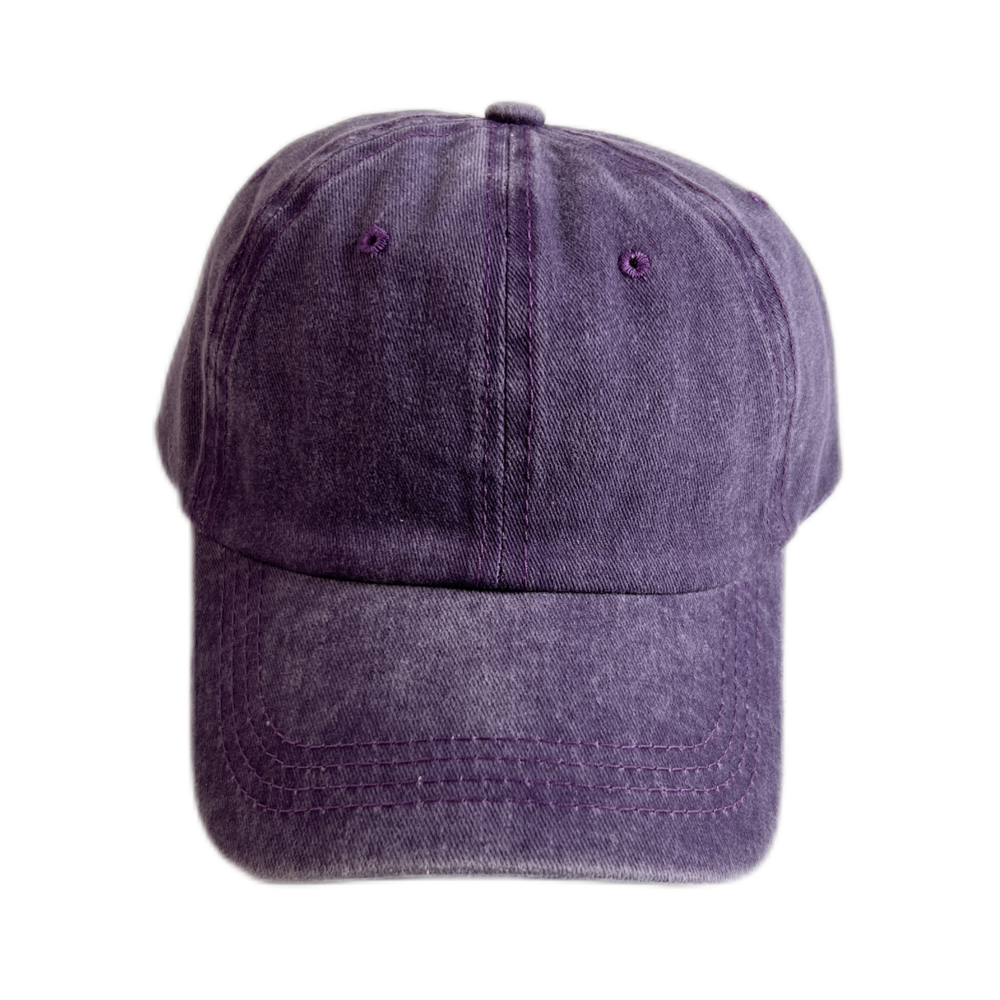 Custom logo on the front panel of a denim cowboys hat, shown next to a printed sample sheet