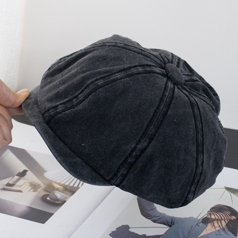 Close-up of the six-panel denim cowboys hat showing stitching detail and metal buckle